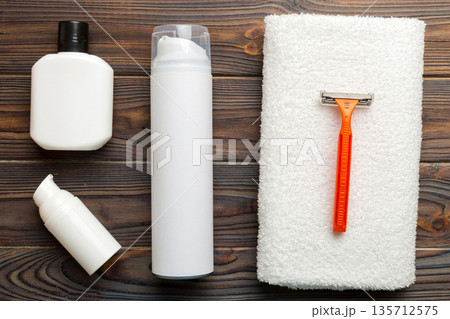 shaving man set. shaving machine, towel, lotion and shaving foam on colored background. Men bath Accessories top view shaving man set. shaving machine, towel, lotion and shaving foam on colored background. Men bath Accessories top view 135712575