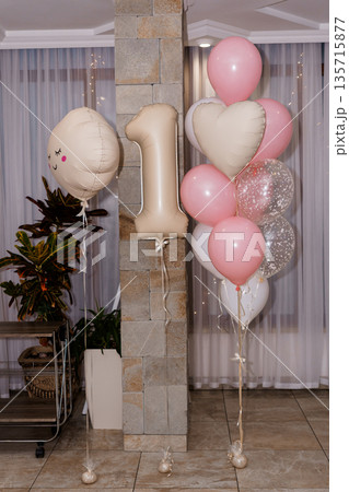 Pink and Beige Balloon Decorations for First Birthday Party with Heart Shapes and Number 1 Balloon in Modern Home Setting 135715877