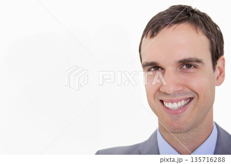 Adult man smiling, posing in studio portrait wearing grey suit and light blue shirt, copy space Adult man smiling, posing in studio portrait wearing grey suit and light blue shirt, copy space 135716288
