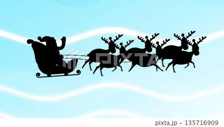 Image of santa claus in sleigh with reindeer over white waves on blue background 135716909