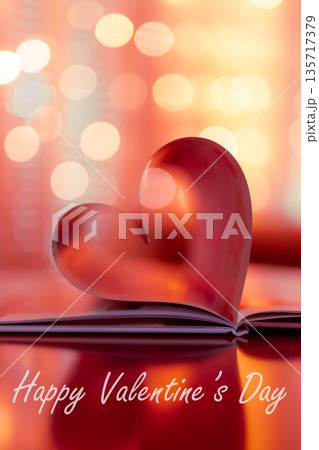 Romantic vertical red Valentine Day heart from folded book pages, glowing warm bokeh blur, soft love lights background, dreamy holiday banner with love quotes 135717379