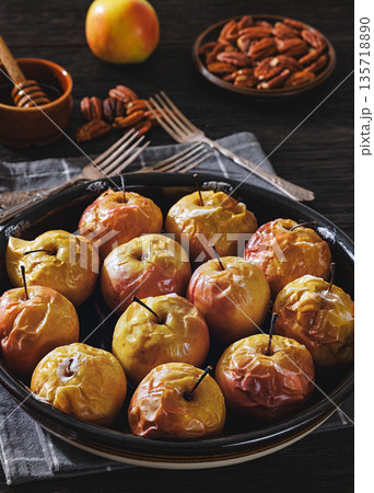 Tasty Baked Apples with Pecans and Honey Tasty Baked Apples with Pecans and Honey 135718890