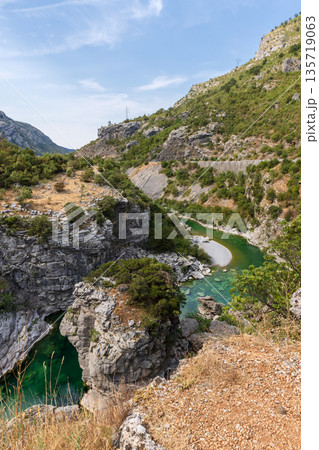 A dramatic canyon scene with a turquoise Moraca river 135719063
