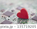Small red heart on computer circuit board. Internet dating concept. 135719205