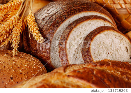 Fresh baked bread. Assorted bakery products loafs of bread and rolls... Fresh baked bread. Assorted bakery products loafs of bread and rolls... 135719268