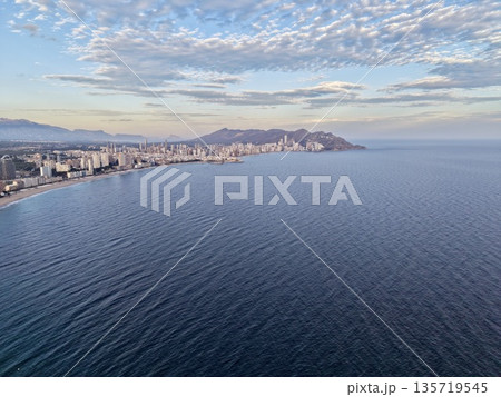 serene seascape for imagery, wide open ocean view showcasing calm waves and distant shoreline 135719545