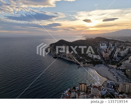 beautiful sunset over landscape, spectacular twilight panorama showcasing glowing hills and distant lights beautiful sunset over landscape, spectacular twilight panorama showcasing glowing hills and distant lights 135719554