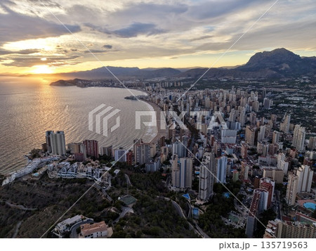 opulent seaside cityscape showcase, lavish beachfront skyline panorama highlighted by golden dusk lighting 135719563