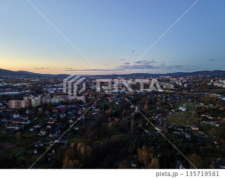 evening coastal tranquility, serene harbor scene with quiet waters and illuminated skyline at dusk evening coastal tranquility, serene harbor scene with quiet waters and illuminated skyline at dusk 135719581