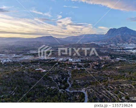 early morning scene showcasing gentle lighting over valley with scattered settlements and mistshrouded ridges 135719624