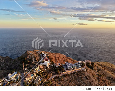 serene neighborhood set amidst dramatic rocky cliffs providing panoramic ocean vistas and relaxation amenities serene neighborhood set amidst dramatic rocky cliffs providing panoramic ocean vistas and relaxation amenities 135719634