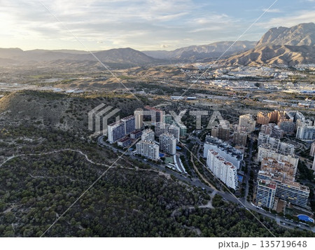 morning view of hillside housing, urban expansion observed from above on hilly terrain at sunrise morning view of hillside housing, urban expansion observed from above on hilly terrain at sunrise 135719648