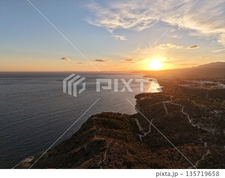 peaceful seascape with distant coastlines and soothing sunset hues that inspire relaxation 135719658