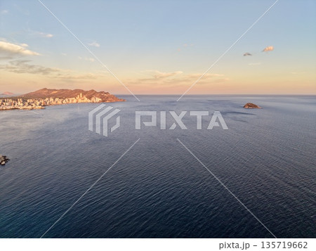 serene evening with warm hues, calm ocean scene with soft sunrise shades and tranquil reflections serene evening with warm hues, calm ocean scene with soft sunrise shades and tranquil reflections 135719662