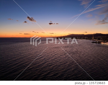 calm waters with illuminated docks, tranquil coastal scene showcasing boats glowing in peaceful harbor calm waters with illuminated docks, tranquil coastal scene showcasing boats glowing in peaceful harbor 135719683
