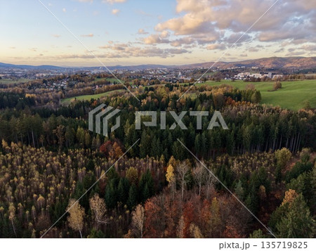 evening rural landscape, golden hour illuminating rural fields and distant forest boundaries evening rural landscape, golden hour illuminating rural fields and distant forest boundaries 135719825