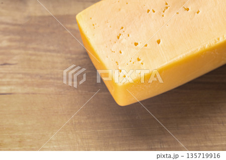 piece of cheese close-up piece of cheese close-up 135719916