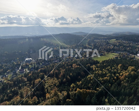 autumn landscape with scattered homes, scenic aerial perspective of rural community in fall season 135720042