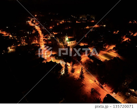 aerial perspective showcasing vintage city center with lit alleys and inviting plazas at night aerial perspective showcasing vintage city center with lit alleys and inviting plazas at night 135720071
