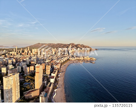 beachfront sunset view, wide shot of beach and city, aerial view showing coast and skyscrapers at sunset beachfront sunset view, wide shot of beach and city, aerial view showing coast and skyscrapers at sunset 135720115