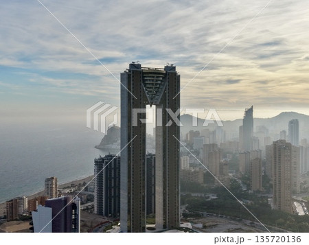 bright towering structures, imposing twin skyscrapers with vivid sunlight and dramatic silhouettes 135720136