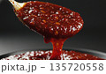 Thick Red Sauce Pouring from Spoon Cooking Detail 4k ai 135720558