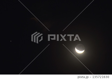 half moon and saturn star floating over cloud on dark sky in night half moon and saturn star floating over cloud on dark sky in night 135721630