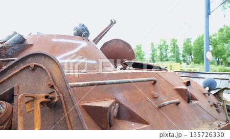Rusty and burned-out armored vehicles on ukrainian territory. Exhibition of destroyed military equipment of the russian army. War between Ukraine and russia. Close up Slow motion Rusty and burned-out armored vehicles on ukrainian territory. Exhibition of destroyed military equipment of the russian army. War between Ukraine and russia. Close up Slow motion 135726330