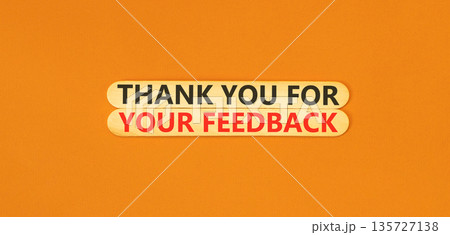 Thank you for your feedback symbol. Concept words Thank you for your feedback on beautiful wooden sticks. Beautiful orange background. Business thank you for your feedback concept. Copy space. 135727138