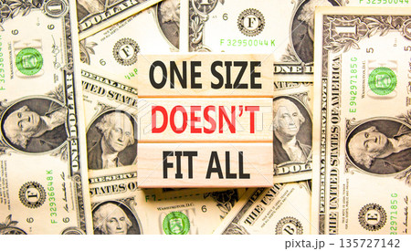 One size does not fit all symbol. Concept words One size does not fit all on beautiful wooden blocks. Beautiful dollar bills background. Business one size does not fit all concept. Copy space. One size does not fit all symbol. Concept words One size does not fit all on beautiful wooden blocks. Beautiful dollar bills background. Business one size does not fit all concept. Copy space. 135727142