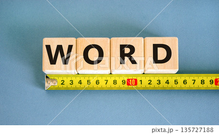 Word symbol. Concept word Word on beautiful wooden blocks. Beautiful yellow ruler. Beautiful blue table blue background. Business, lifestyle, support and word concept. Copy space. 135727188