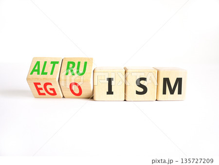 Altruism or egoism symbol. Concept words Egoism to Altruism on beautiful wooden cubes. Beautiful white table white background. Business, psychological and altruism or egoism concept. Copy space. Altruism or egoism symbol. Concept words Egoism to Altruism on beautiful wooden cubes. Beautiful white table white background. Business, psychological and altruism or egoism concept. Copy space. 135727209