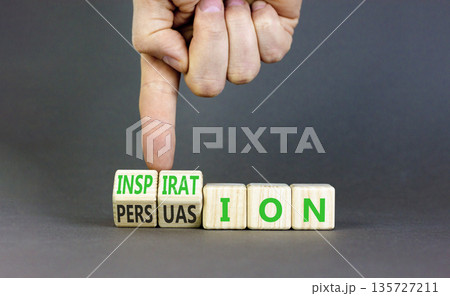 Persuasion or inspiration symbol. Concept words Persuasion and Inspiration on wooden cubes. Beautiful grey background. Psychologist hand. Psychology persuasion inspiration concept. Copy space. 135727211