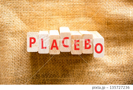 Placebo word medical symbol. Concept word Placebo on beautiful wooden blocks. Beautiful canvas background. Business placebo word medical concept. Copy space. 135727236