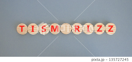 Tism rizz symbol. Concept word Tism rizz on beautiful wooden circles. Beautiful grey background. Business education support tism rizz concept. Copy space. 135727245