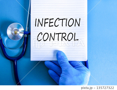 Infection control symbol. Concept words Infection control on beautiful white note. Doctor's hand in blue medical glove. Beautiful blue background. Medical healthy lifestyle infection control concept. 135727322