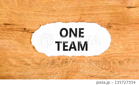 One team symbol. Concept word One team on beautiful white paper. Beautiful wooden paper background. Business one team concept. Copy space. 135727354