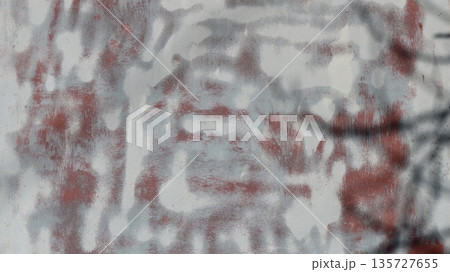 Blurred image of chaotic lines and splashes of white sprayed paint on a reddish metallic oxidized surface, abstract smoothed texture as a blank art background Blurred image of chaotic lines and splashes of white sprayed paint on a reddish metallic oxidized surface, abstract smoothed texture as a blank art background 135727655