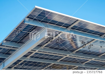 Solar panel installation in outdoor parking lot 135727768