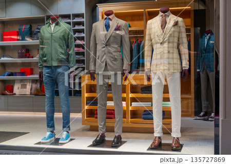 Male dummy in a shop window. Sale of men's clothing. 135727869