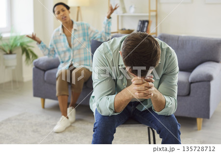 A young family couple faces a relationship conflict after a heated disagreement A young family couple faces a relationship conflict after a heated disagreement 135728712