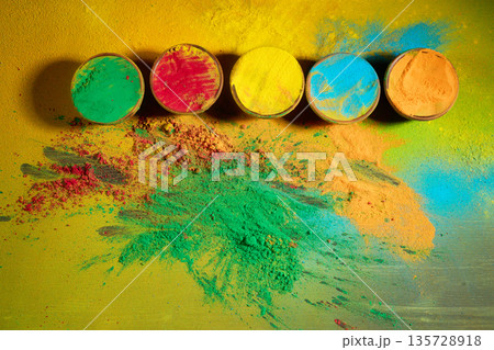 Holi festival celebration with colorful gulal powder and pigment Holi festival celebration with colorful gulal powder and pigment 135728918