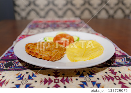 A dish on a plate. 135729073