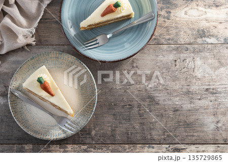 Carrot cake slice with cream cheese frosting Carrot cake slice with cream cheese frosting 135729865