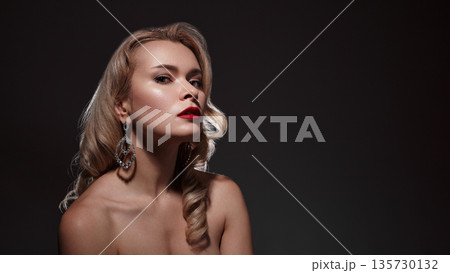 Beautiful Sexy Woman with Fashion Make-up and Blond Curly Wave Hairstyle, Bright Accessories. Glamour Pin-up Girl with Red lips. American Diva Style with Brilliant Earrings and Rings Beautiful Sexy Woman with Fashion Make-up and Blond Curly Wave Hairstyle, Bright Accessories. Glamour Pin-up Girl with Red lips. American Diva Style with Brilliant Earrings and Rings 135730132