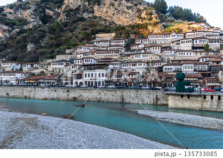 Traditional residential district with historic houses and Osum river in the foreground in the old town area of Berat, Albania Traditional residential district with historic houses and Osum river in the foreground in the old town area of Berat, Albania 135733085