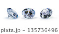 Beautiful Brilliant cut diamond held by tweezers on white background 135736496