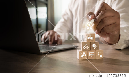 ISO quality certification and compliance concept document control and verified badge, businessman points to ISO blocks, showing quality assurance and audit readiness. ISO quality certification and compliance concept document control and verified badge, businessman points to ISO blocks, showing quality assurance and audit readiness. 135738836