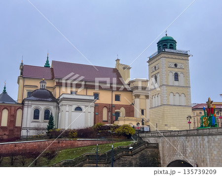 Historic St. Anne's Church and bell tower in Warsaw during overcast weather Historic St. Anne's Church and bell tower in Warsaw during overcast weather 135739209