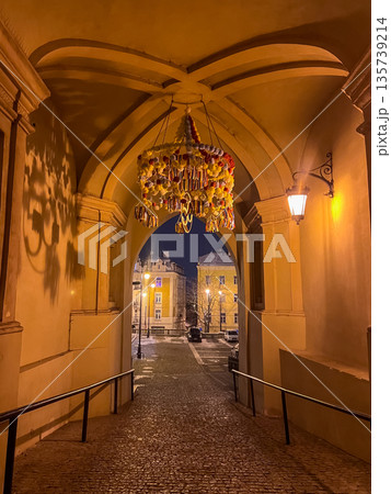 Night view of archway with decorations in a city at dusk 135739214